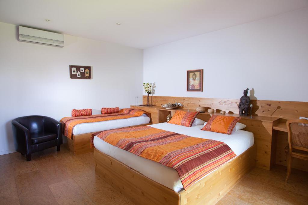 Postel nebo postele na pokoji v ubytování Hôtel Auberge de Chavannes