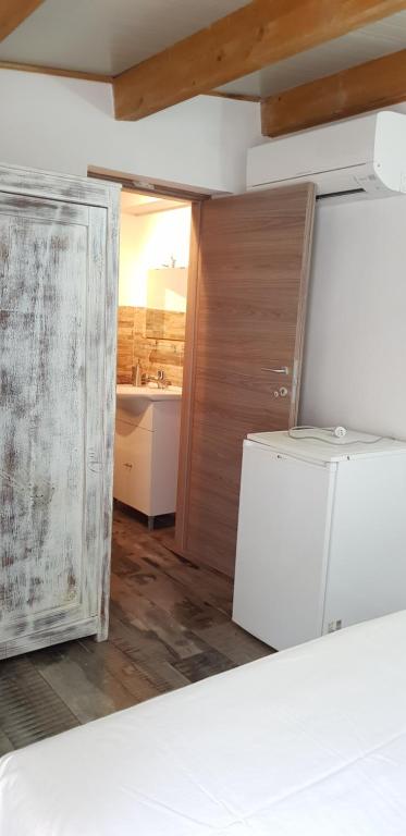 Postel nebo postele na pokoji v ubytování Aliga