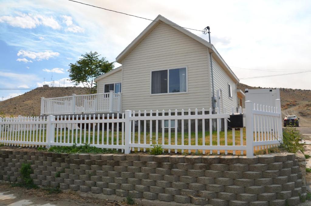 a house with a white picket fence at Baby Blue Sky - Price 2bd - Newly remodeled - nearby trails in Price