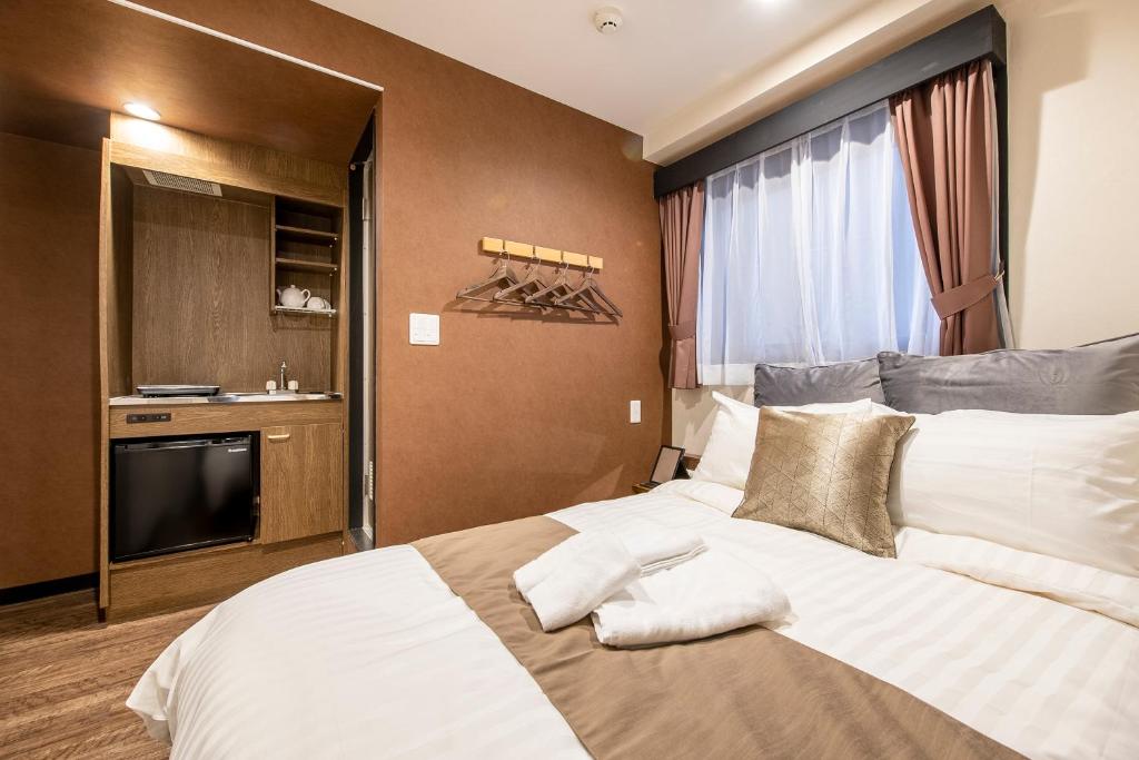 Postel nebo postele na pokoji v ubytování The Park Hotel Akihabara