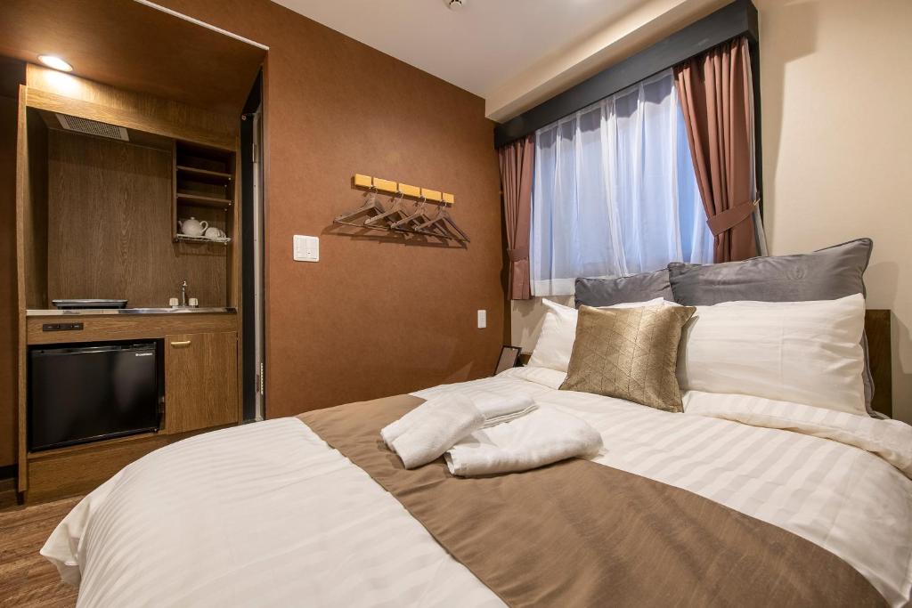 Postel nebo postele na pokoji v ubytování The Park Hotel Akihabara