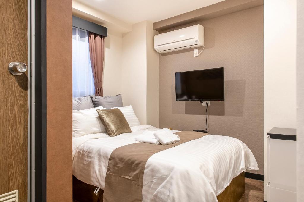 Postel nebo postele na pokoji v ubytování The Park Hotel Akihabara