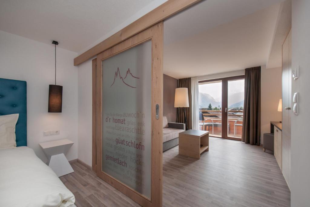 Postel nebo postele na pokoji v ubytování Hotel Bergwelt
