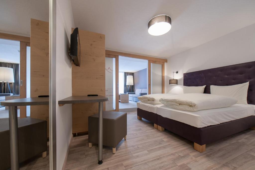 Postel nebo postele na pokoji v ubytování Hotel Bergwelt