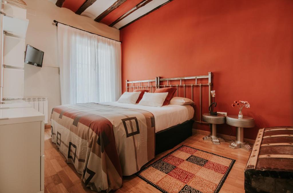 A bed or beds in a room at Haro Apartments