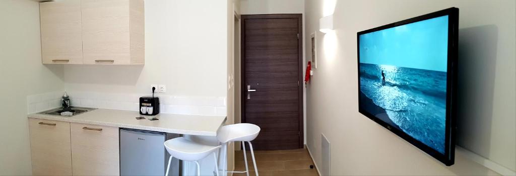 Televízia a/alebo spoločenská miestnosť v ubytovaní CELENI APARTMENTS