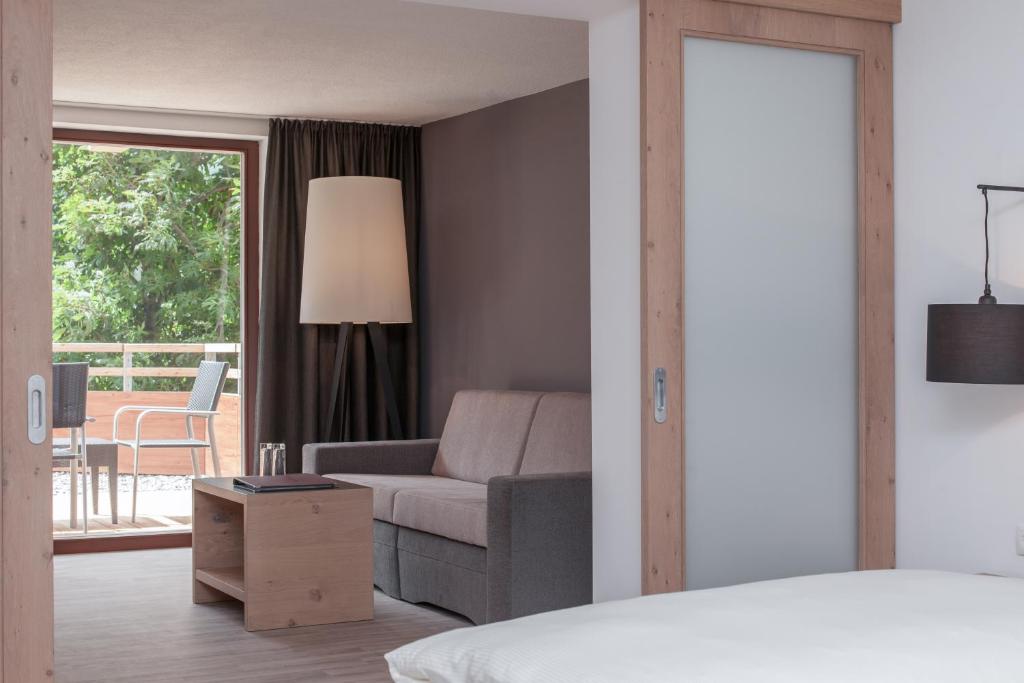 Postel nebo postele na pokoji v ubytování Hotel Bergwelt