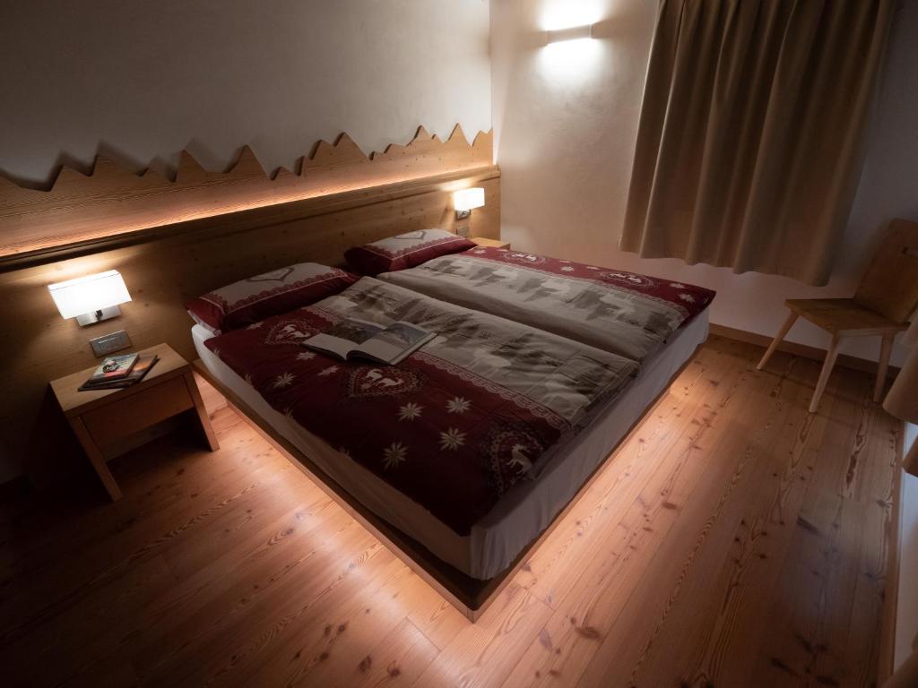 Postel nebo postele na pokoji v ubytování Stella Alpina Suite