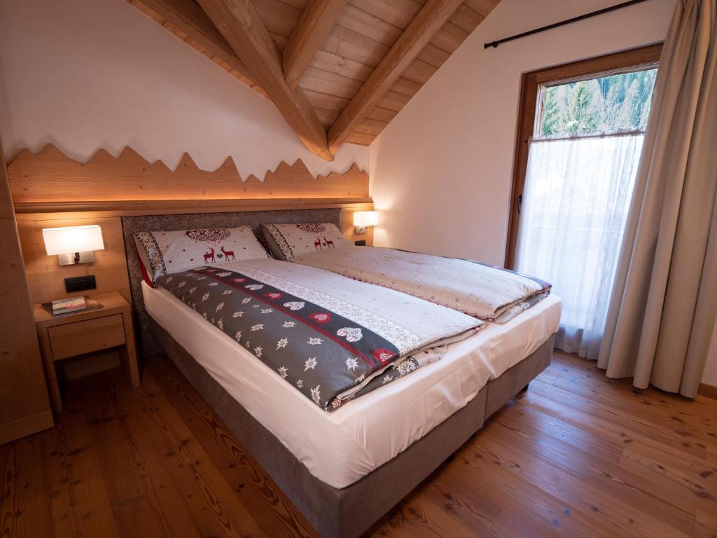 Postel nebo postele na pokoji v ubytování Stella Alpina Suite