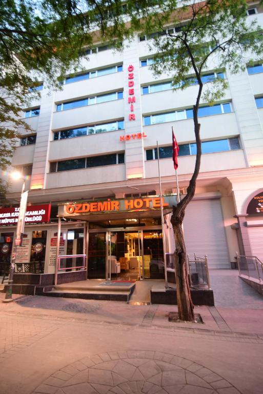 a building with a sign that reads dynamic hotel at Özdemir Palas in Ankara