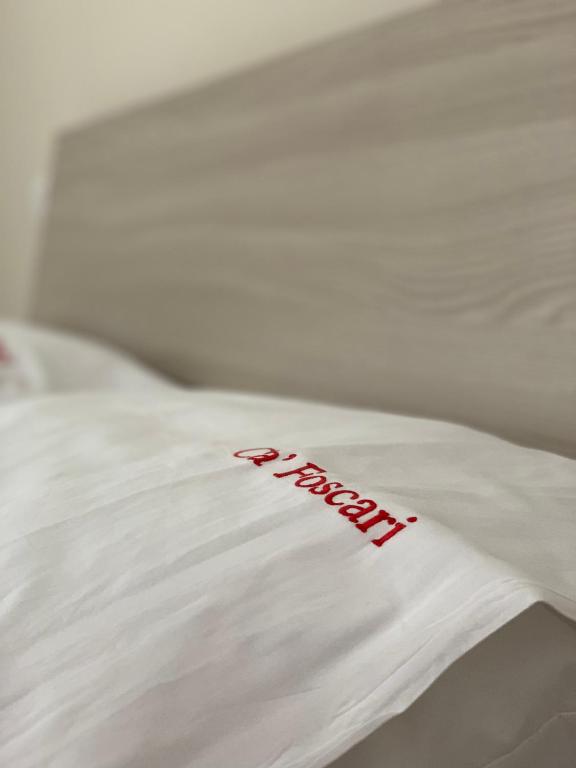 Łóżko lub łóżka w pokoju w obiekcie CA FOSCARI Apartments San Siro