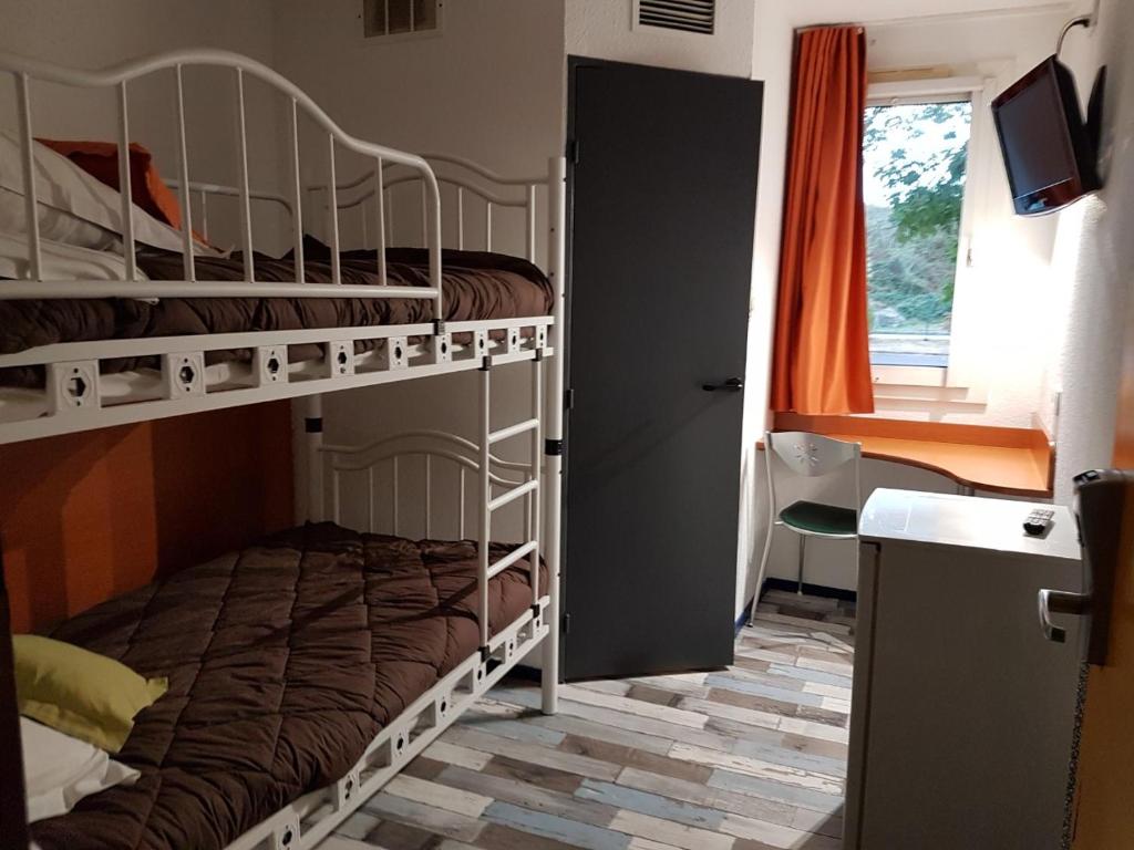 Postel nebo postele na pokoji v ubytování Welcomotel Limoges