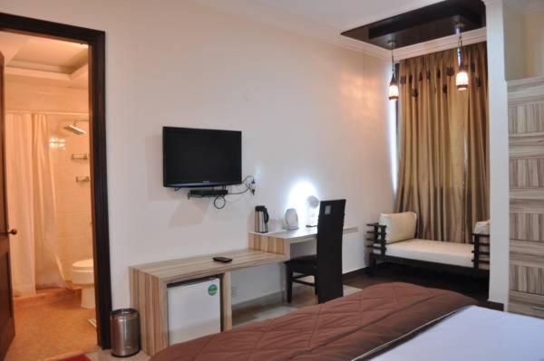 Postel nebo postele na pokoji v ubytování Solo Victoria Hotel