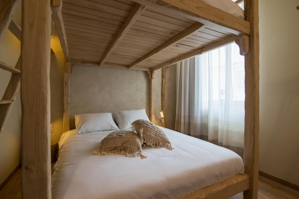 Postel nebo postele na pokoji v ubytování Ederlezi Boutique Hotel