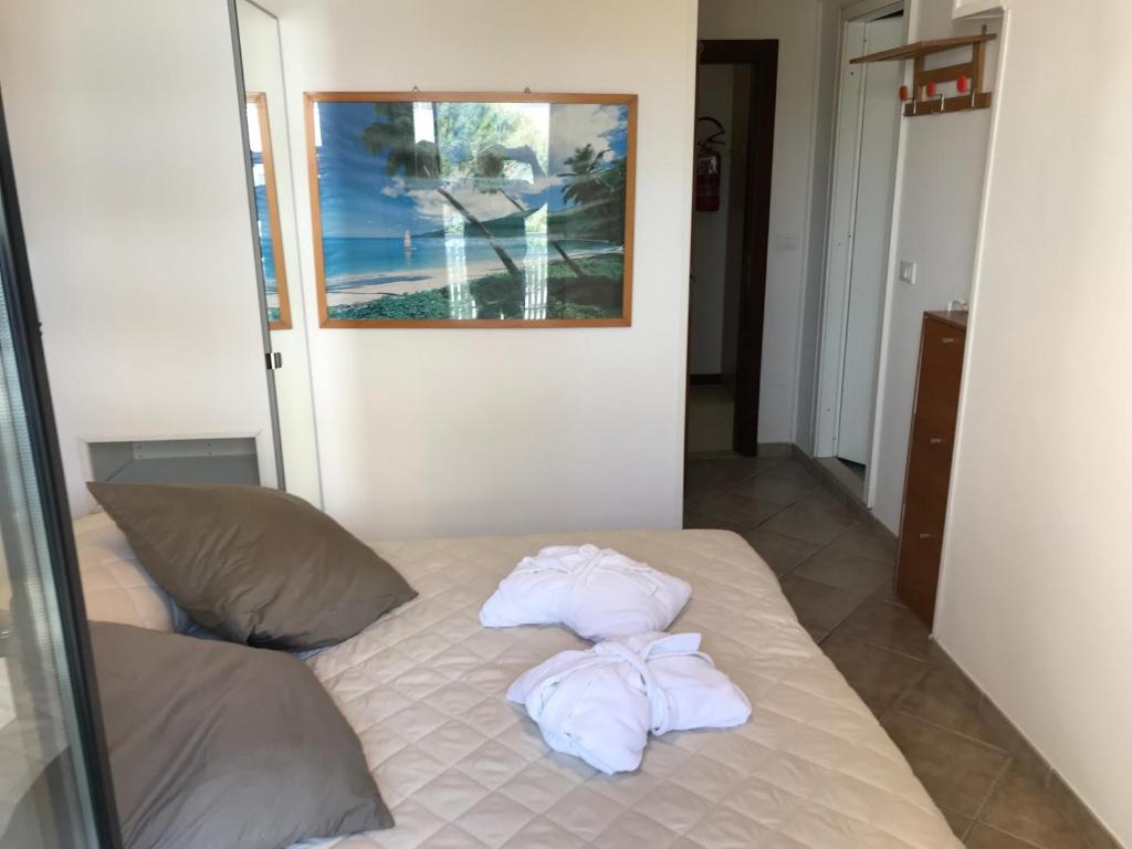 Postel nebo postele na pokoji v ubytování Hotel Byron