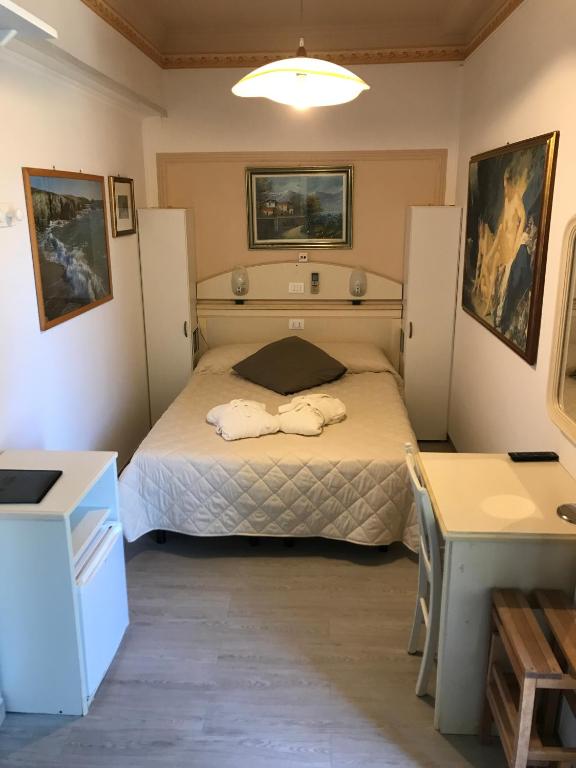 Postel nebo postele na pokoji v ubytování Hotel Byron