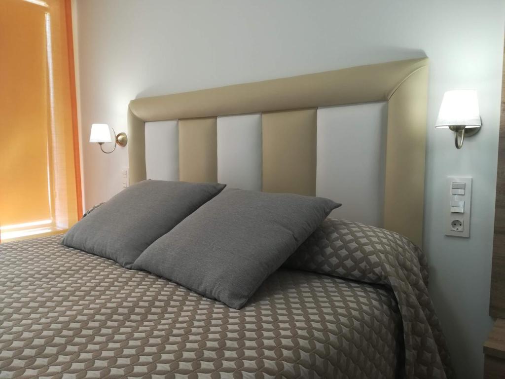 Posteľ alebo postele v izbe v ubytovaní Hostal y Apartamento Rural Los Naranjos