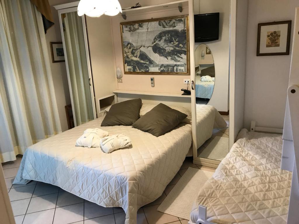 Postel nebo postele na pokoji v ubytování Hotel Byron