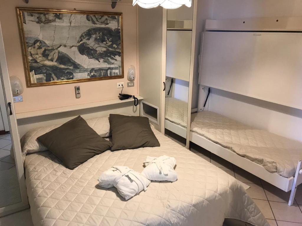 Postel nebo postele na pokoji v ubytování Hotel Byron