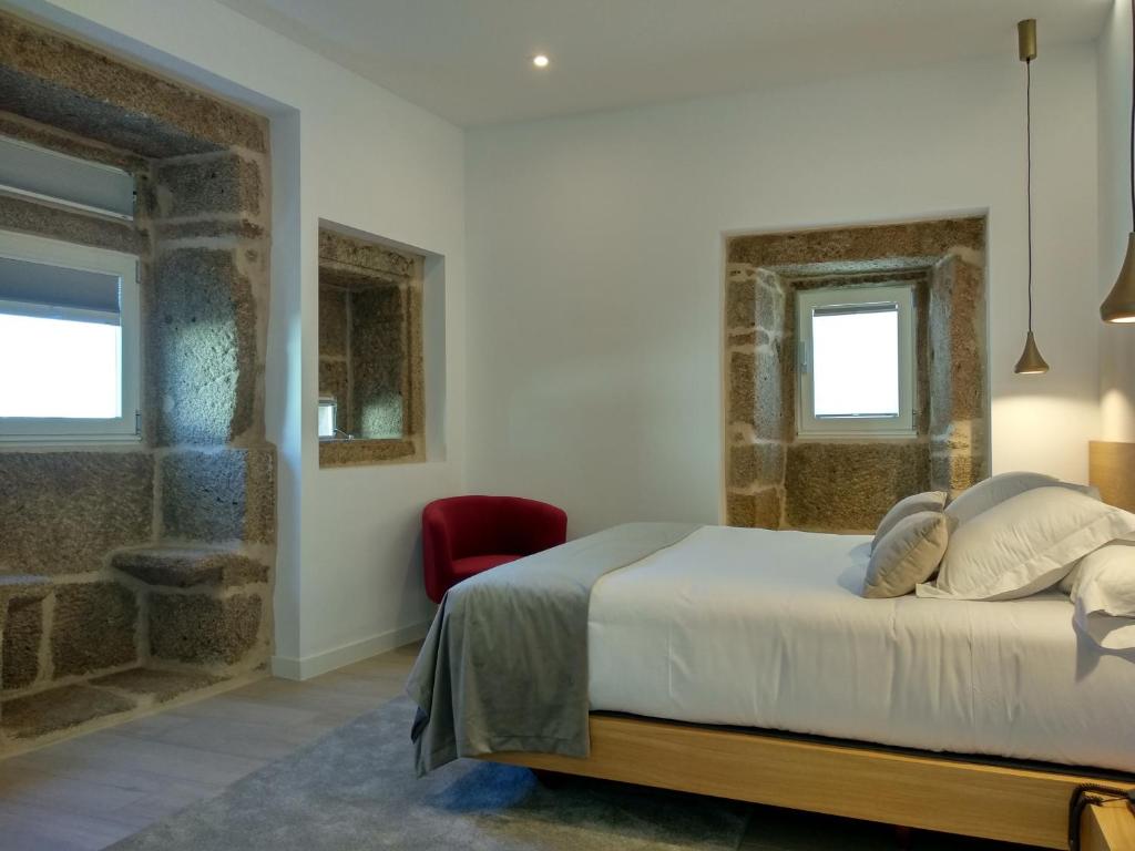 A bed or beds in a room at Hotel Nande