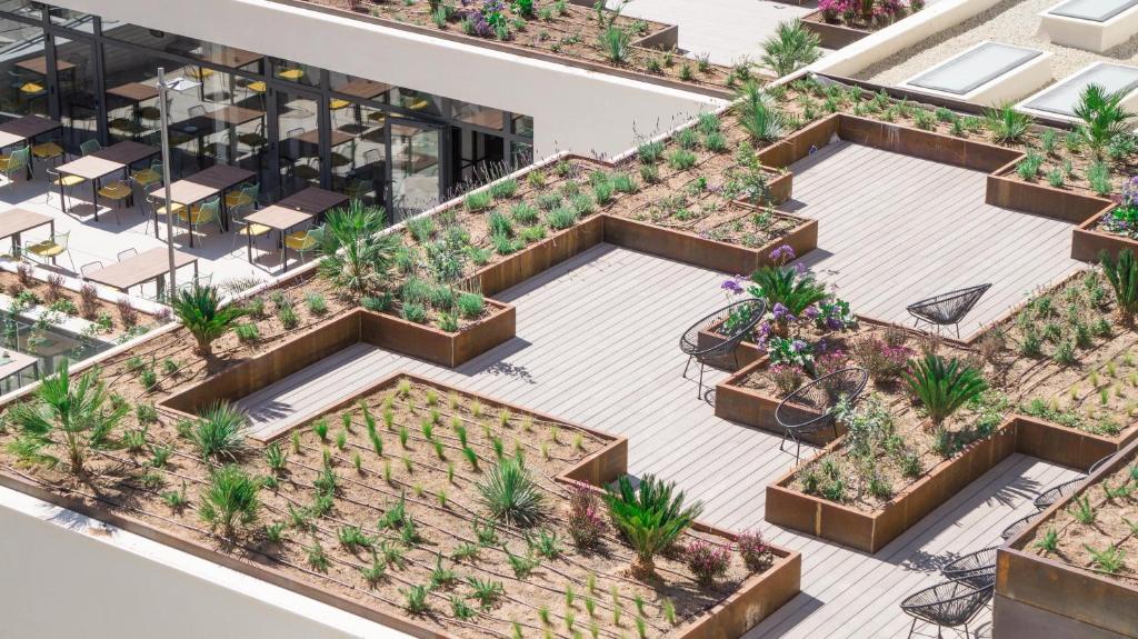 an overhead view of a building with plants at Hotel Paradiso Garden in Playa de Palma