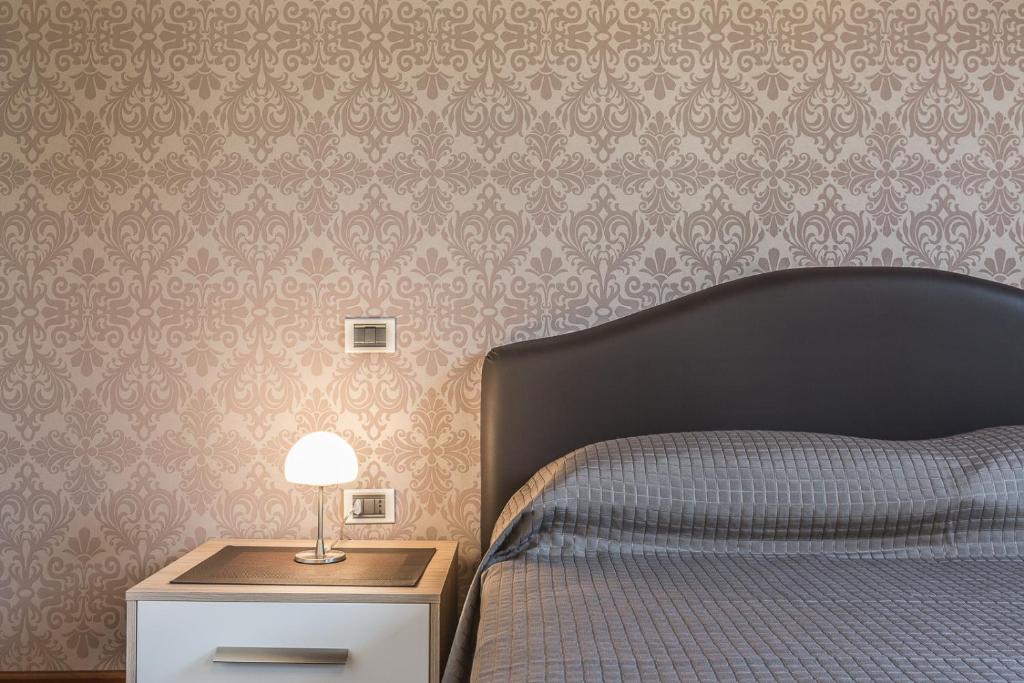 Posteľ alebo postele v izbe v ubytovaní Ca' Del Monastero 3 Collection Apartment for 4 Guests with Lift