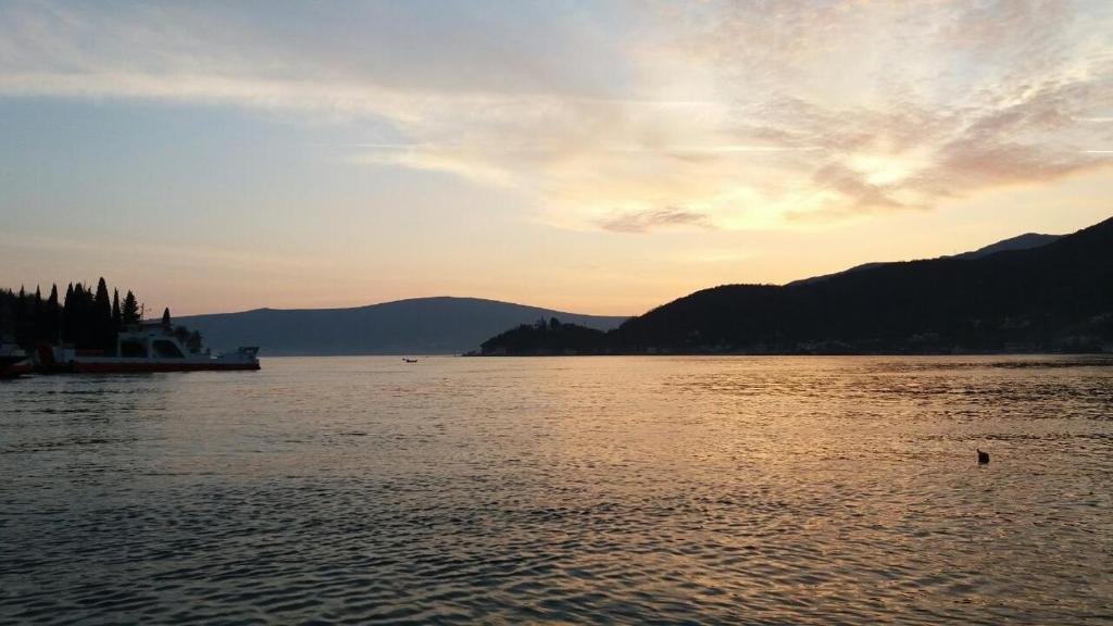a view of a large body of water at sunset at House by The Sea in Tivat