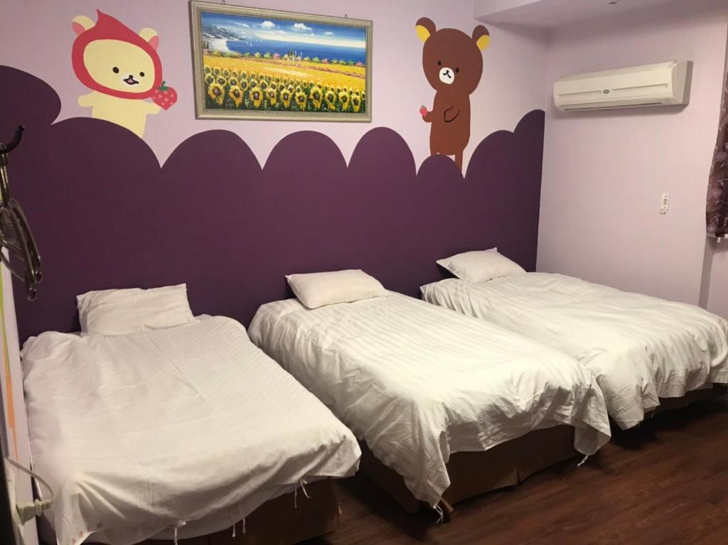 Voodi või voodid majutusasutuse 陽光綠堤民宿 toas