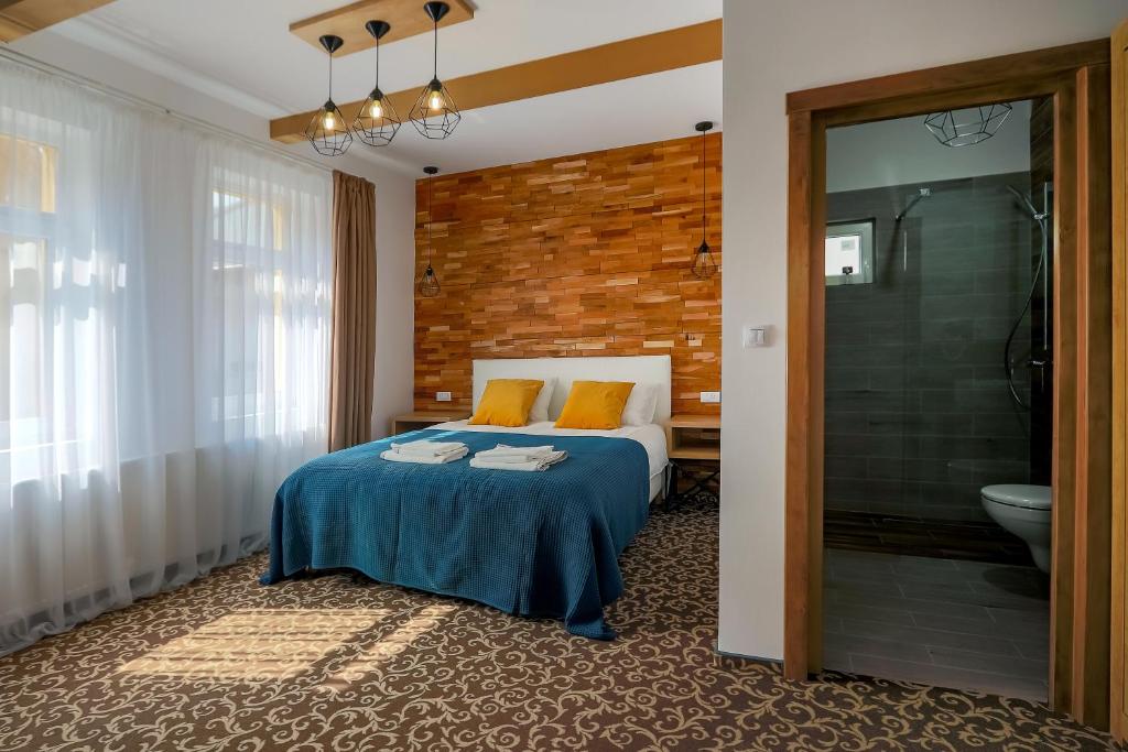 Postel nebo postele na pokoji v ubytování Residence Rooms Bucovina