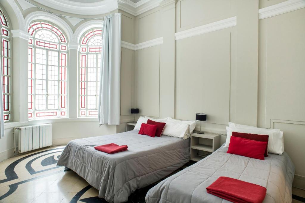 Una cama o camas en una habitación de Patios de Recoleta