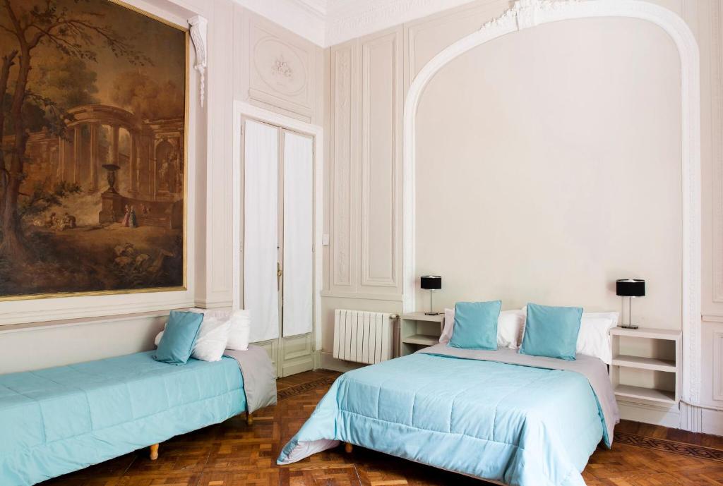 Una cama o camas en una habitación de Patios de Recoleta