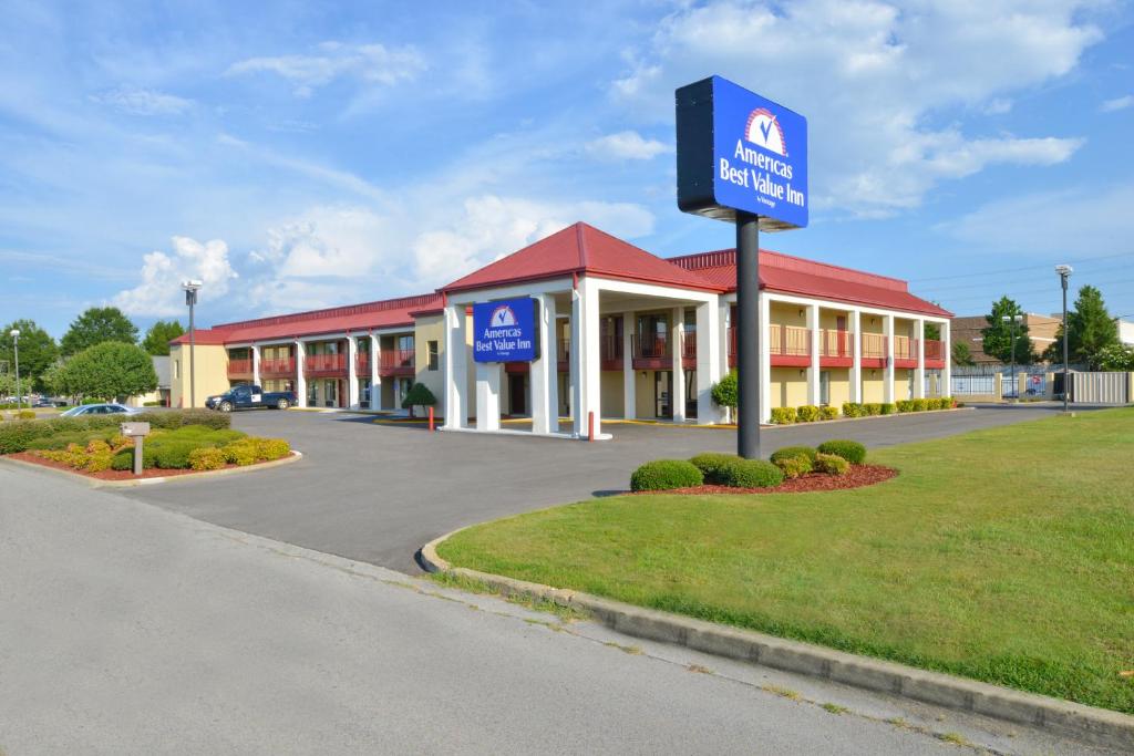 a large building with a sign in front of it at Americas Best Value Inn Tupelo Barnes Crossing in Tupelo