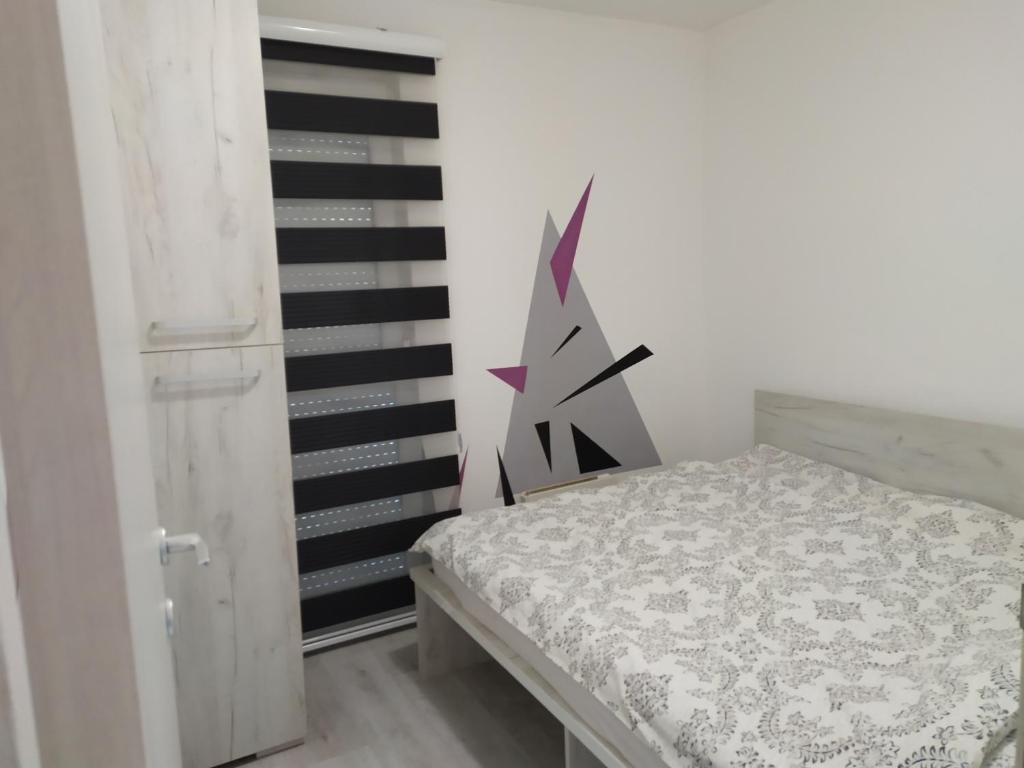 Postel nebo postele na pokoji v ubytování Apartment Triangle