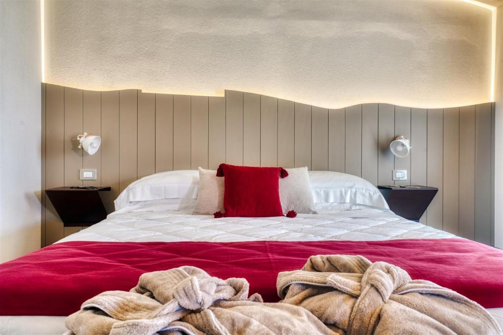 Posteľ alebo postele v izbe v ubytovaní Podere Maremma Spa & Ristorante