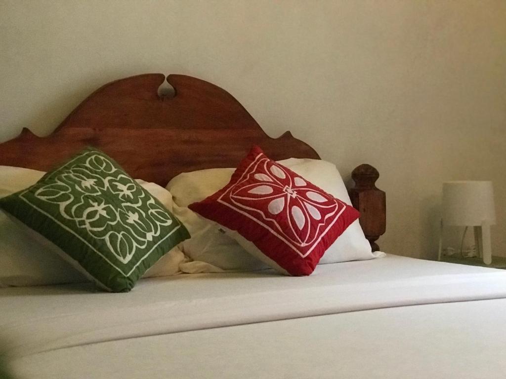 Postel nebo postele na pokoji v ubytování zLife Stone Town
