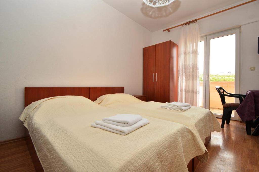 Cama o camas de una habitación en Apartments Dario