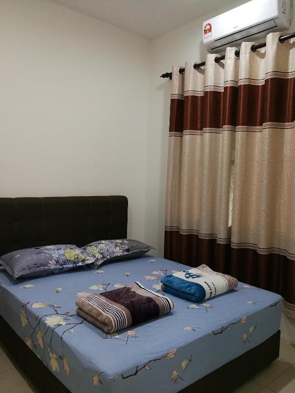 Postel nebo postele na pokoji v ubytování Address No 915, Lorong Uni Central 13, Taman Uni Central, Kuching Samarahan Expressway