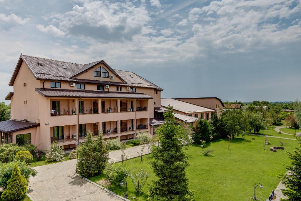 an aerial view of a building with a large yard at Club Insieme Grand Resort in Potlogi