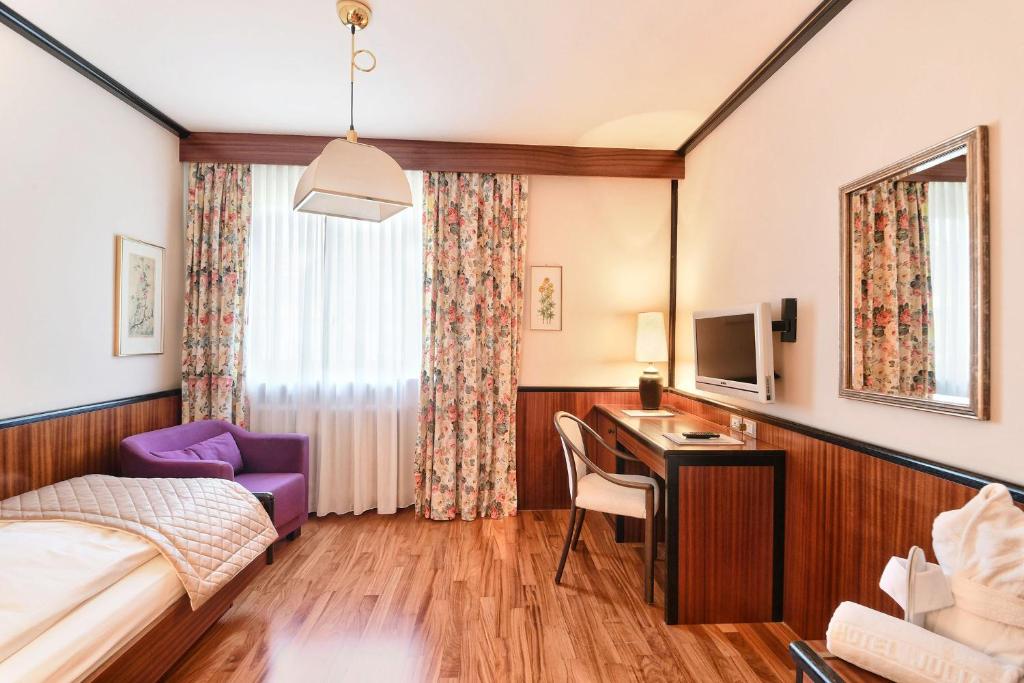 Postel nebo postele na pokoji v ubytování Hotel Juliane