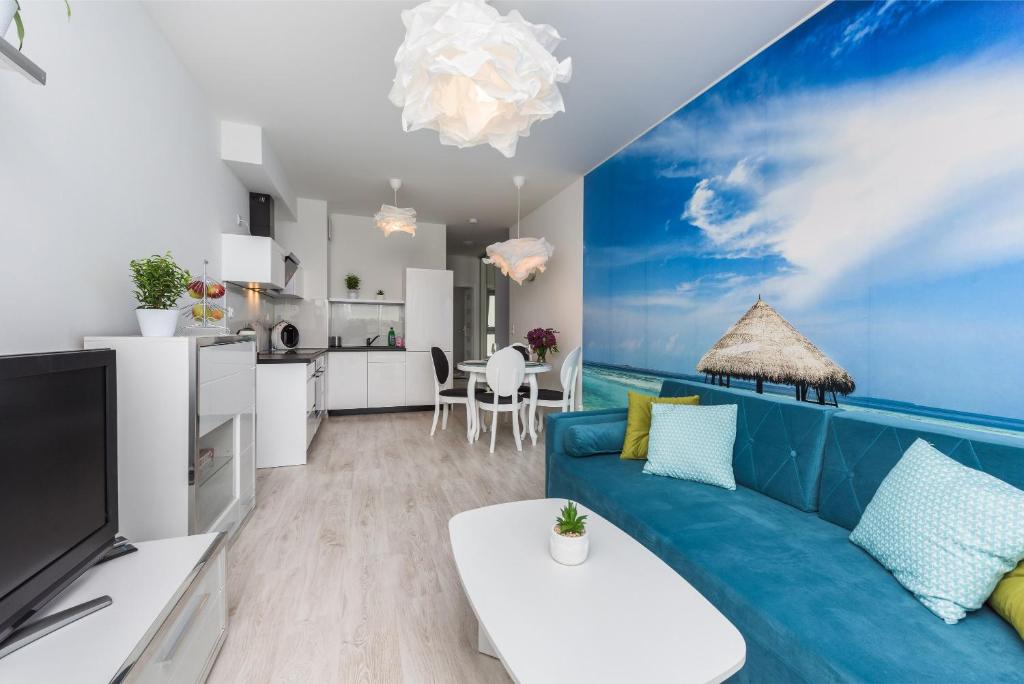 Televízia a/alebo spoločenská miestnosť v ubytovaní APARTAMENT NIKOLA