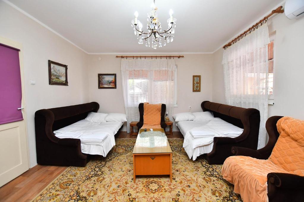 Postel nebo postele na pokoji v ubytování Kaza apartment