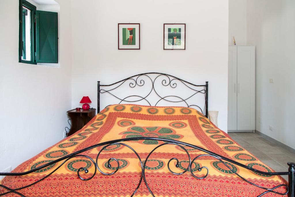 Postel nebo postele na pokoji v ubytování Physis b&b-a casa di Clio