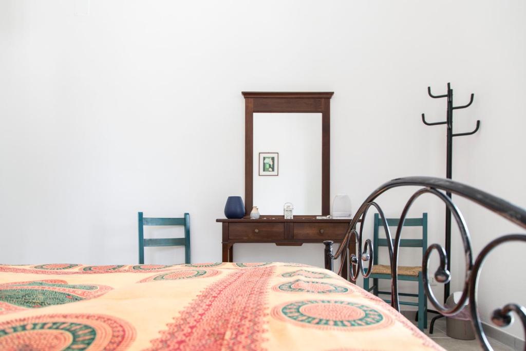 Postel nebo postele na pokoji v ubytování Physis b&b-a casa di Clio