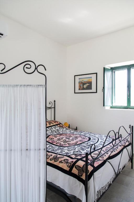 Postel nebo postele na pokoji v ubytování Physis b&b-a casa di Clio