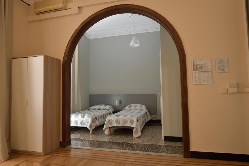 Postel nebo postele na pokoji v ubytování Check-Inn Rooms Genova Centro