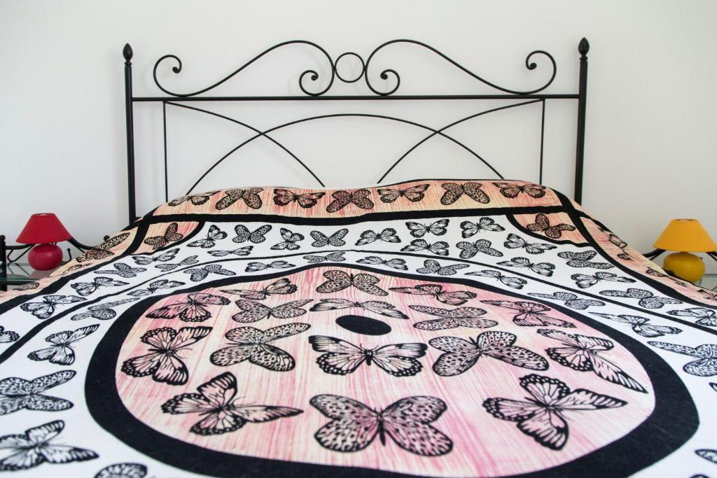 Postel nebo postele na pokoji v ubytování Physis b&b-a casa di Clio