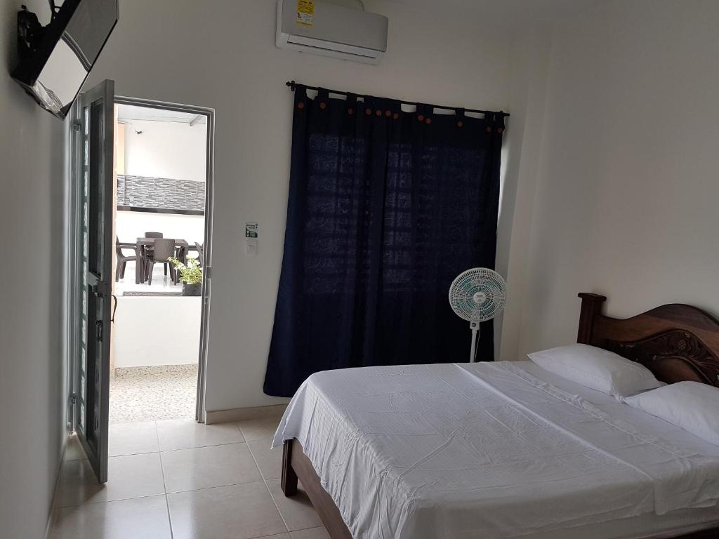 Postel nebo postele na pokoji v ubytování Hotel Palmari