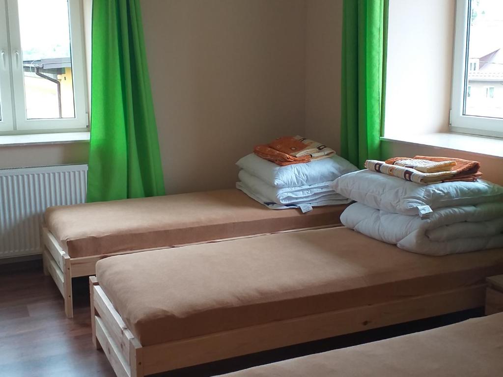 Postel nebo postele na pokoji v ubytování STARY SPICHLERZ