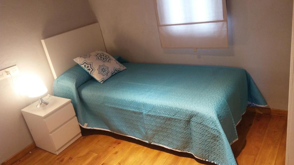 Postel nebo postele na pokoji v ubytování La Casita de la cruz