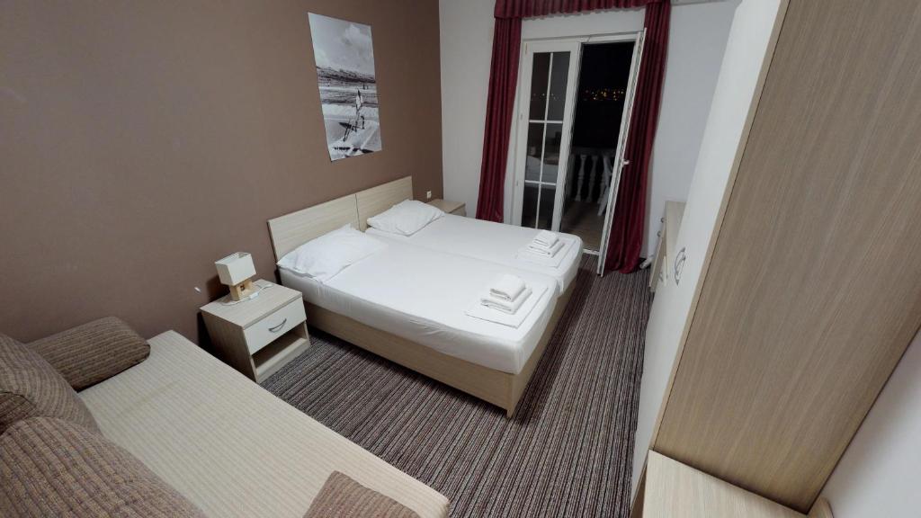 Postel nebo postele na pokoji v ubytování Hotel Belveder